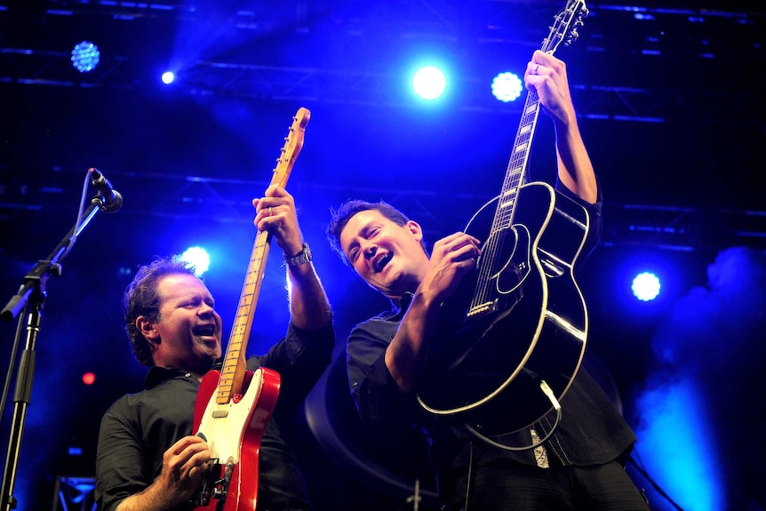 Some musicians playing on stage.