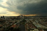 Heavy, dark clouds over Perth city centre at sunset