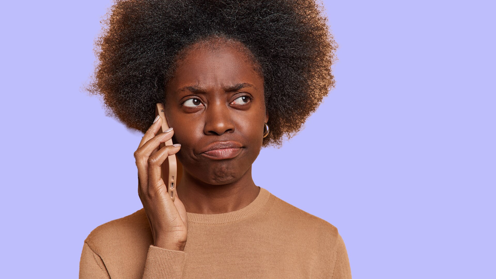 woman holds phone to her ear looking confused with purple background