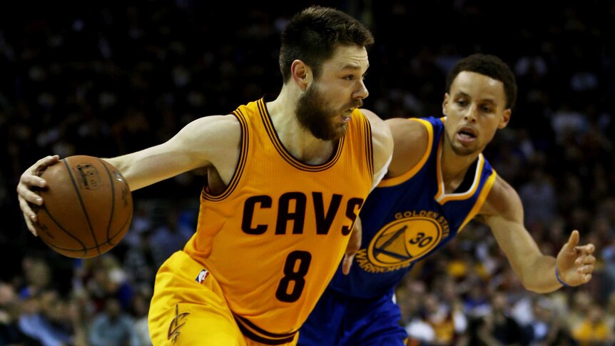 Key role ... Matthew Dellavedova (L) drives against Stephen Curry during Game Three