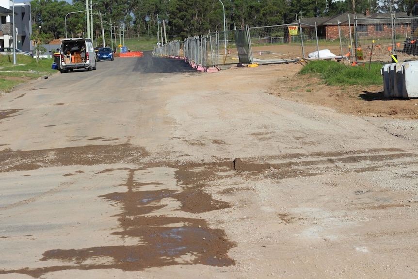 A street with potholes in the road