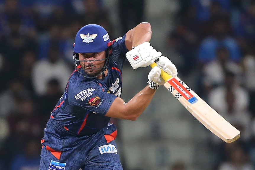 Marcus Stoinis plays a shot during the Indian Premier League cricket match between Gujarat Titans and Lucknow Super Giants