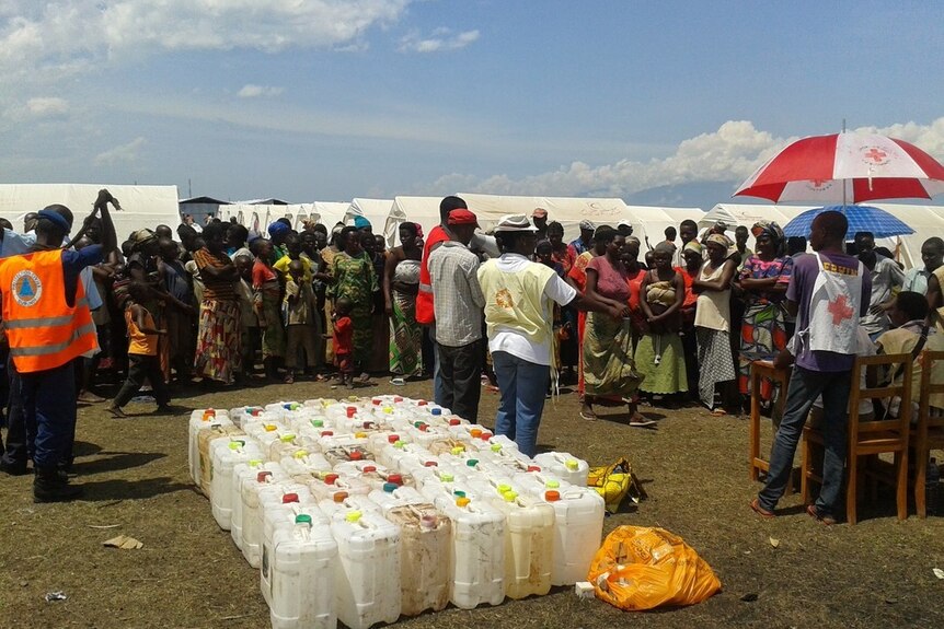 Red Cross workers in Burundi work to distribute aid