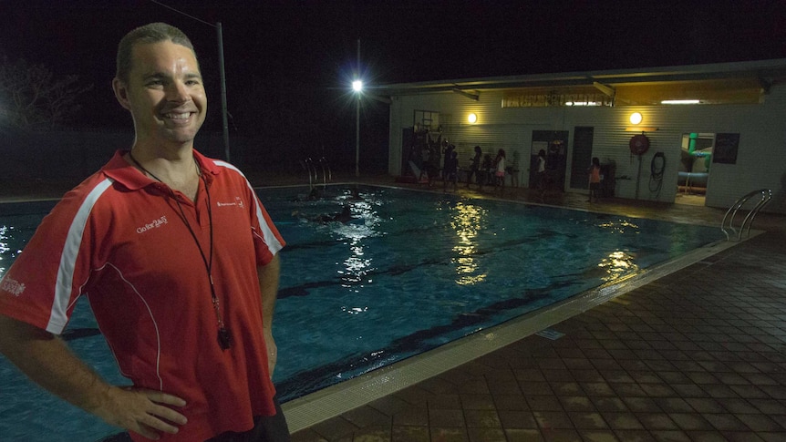 Aaron Jacobs stands in front of the Fitzroy Crossing public pool.