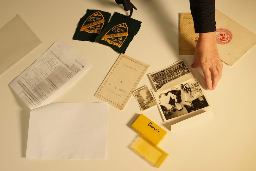 An aerial photo of a series of archival items laid out on a table.