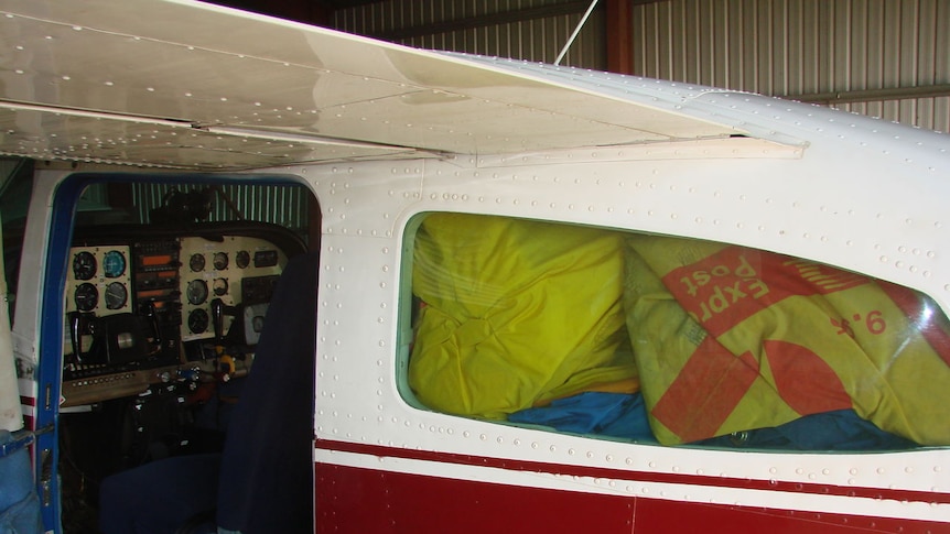 The Cessna 210 is loaded up with mail to be delivered across the Victoria River District.