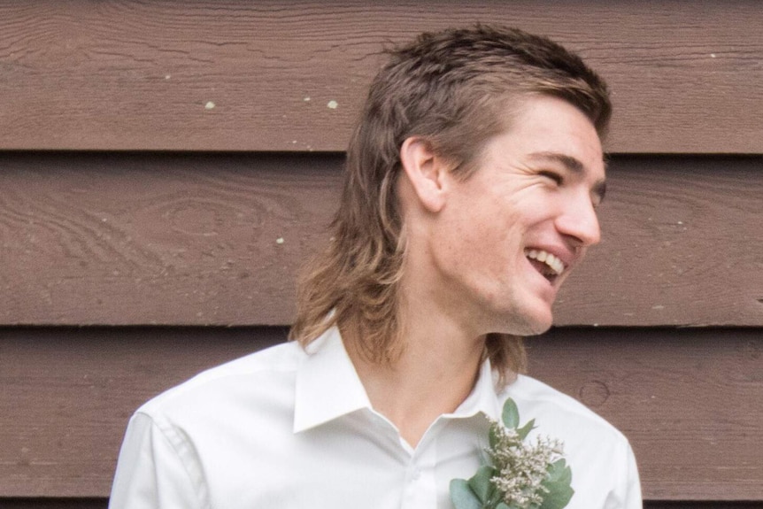 Man in formal wear with mullet