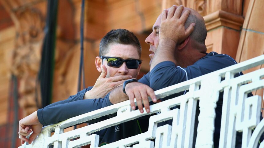 Looking for answers ... Michael Clarke (L) and Darren Lehmann chat during day two