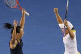 Casey Dellacqua and Ashleigh Barty celebrate their semi-final win.