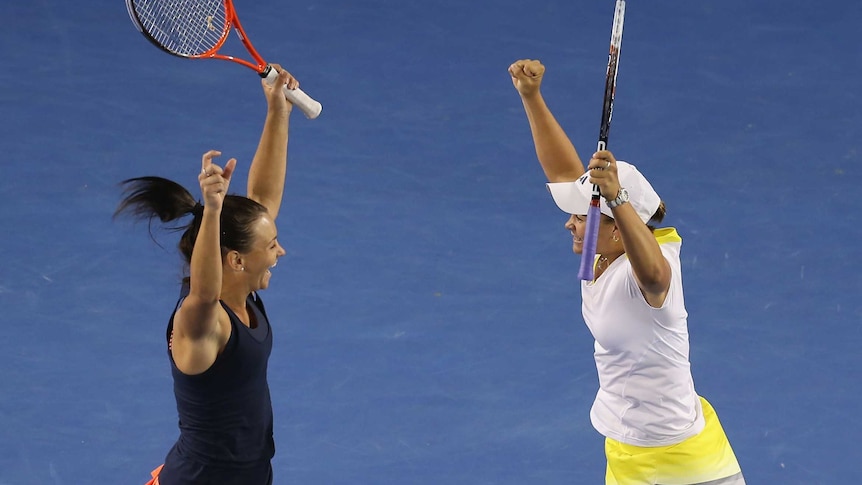 LtoR Casey Dellacqua and Ashleigh Barty celebrate doubles semi-final win.