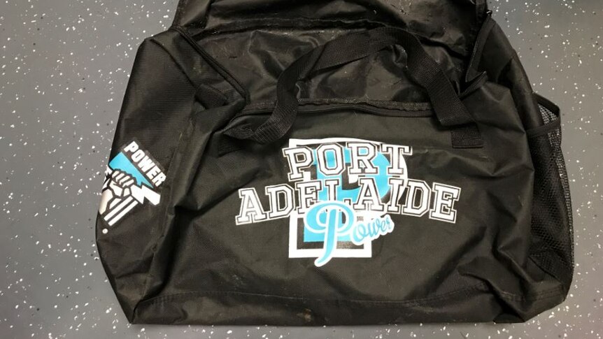 A Port Adelaide Football Club bag.