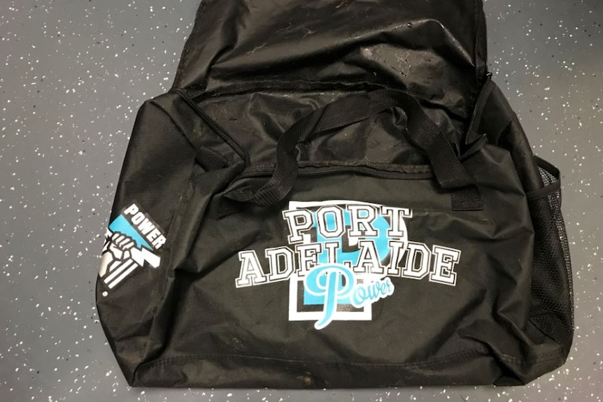 A Port Adelaide Football Club bag.