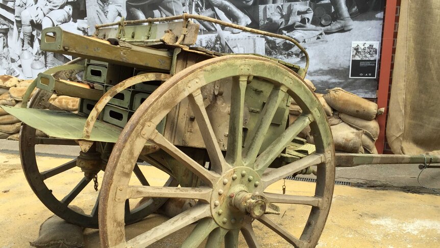 The display includes a replica World War I artillery gun.