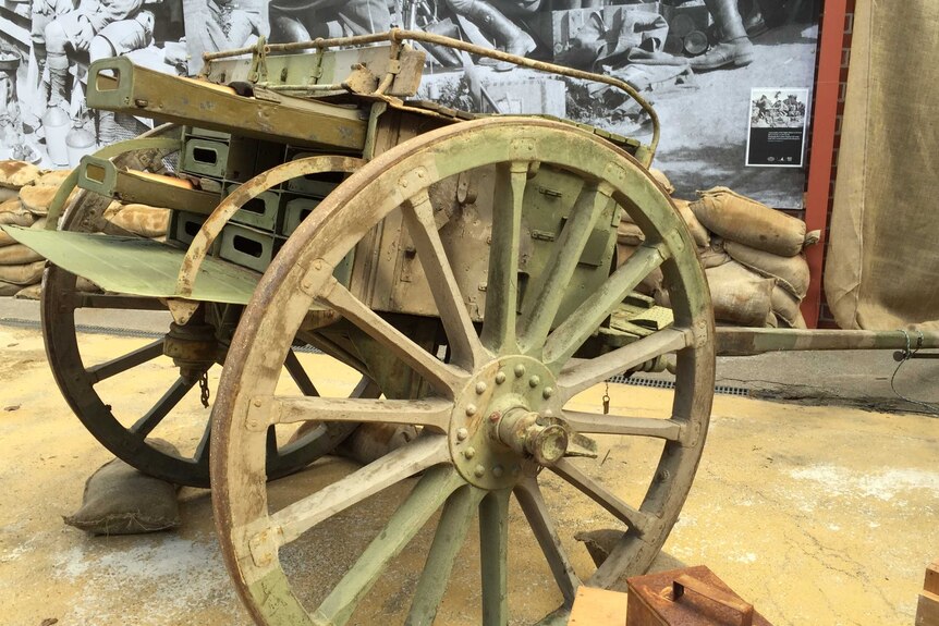 The display includes a replica World War I artillery gun.