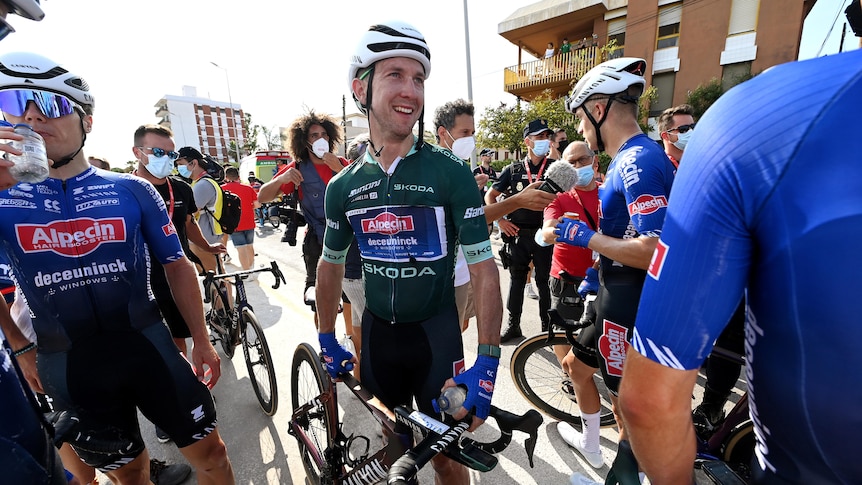 Kaden Groves stands by his bike after winning a stage of La Vuelta a Espana.