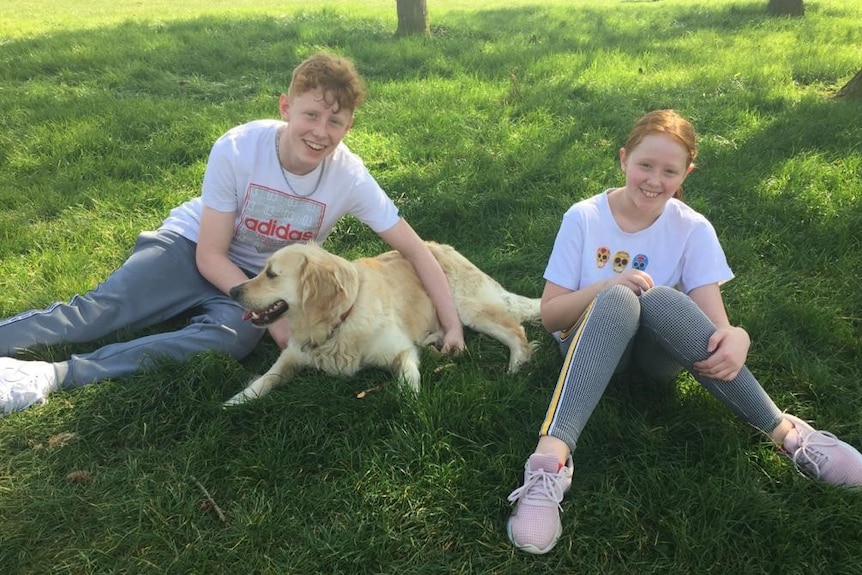 Dan (left) and Cailyn (right) wit their dog.