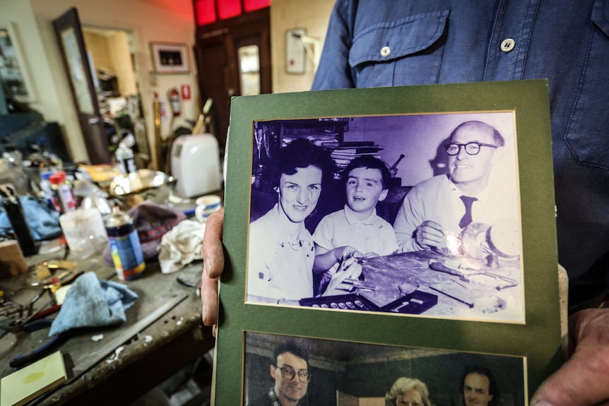 A photo of young Dan Flynn flanked by his parents.