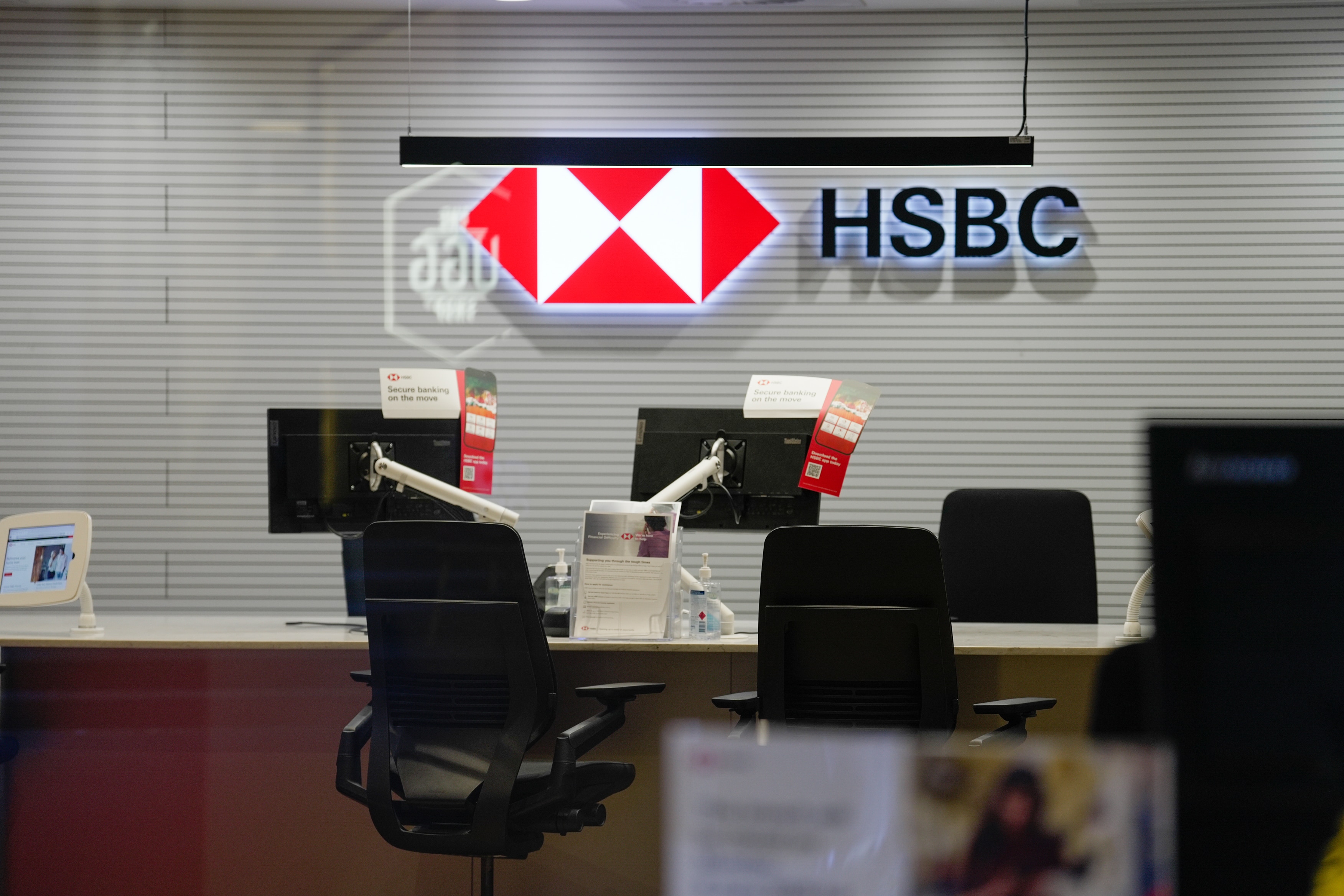 Inside the HSBC bank with desks and computers.