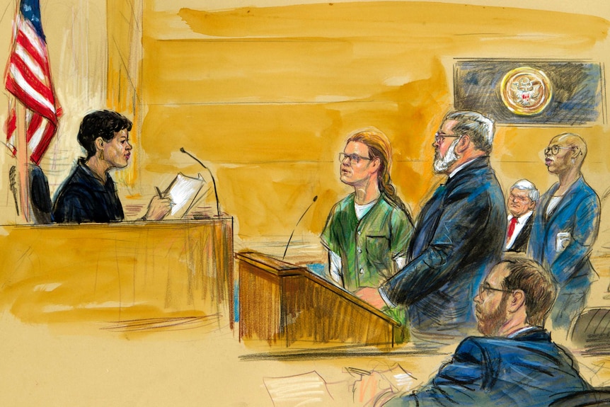 A sketch shows a female judge in front of a US flag looking towards a woman in prison greens and men in suits