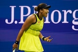Female tennis player screaming after losing a match