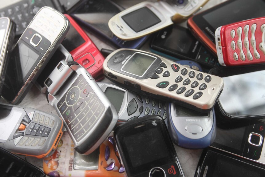 Pile of discarded mobile phones