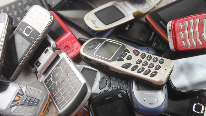 Pile of discarded mobile phones