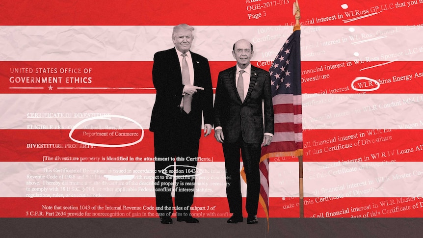 Donald Trump points to his Secretary of Commerce Wilbur Ross as they pose in front of the US flag.