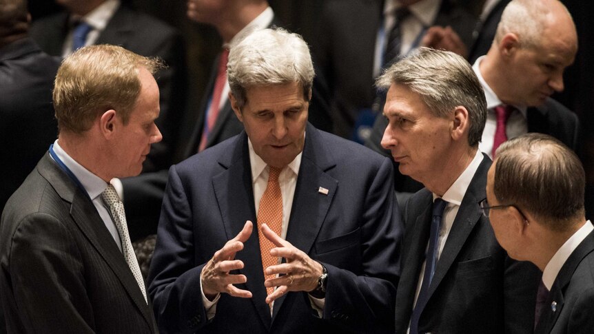 John Kerry speaks to Christopher Prentice prior to security council meeting on Syria