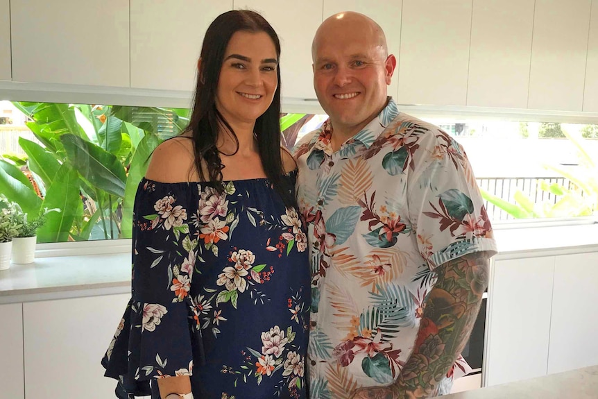 Trudie and Dominic Harris standing in a kitchen