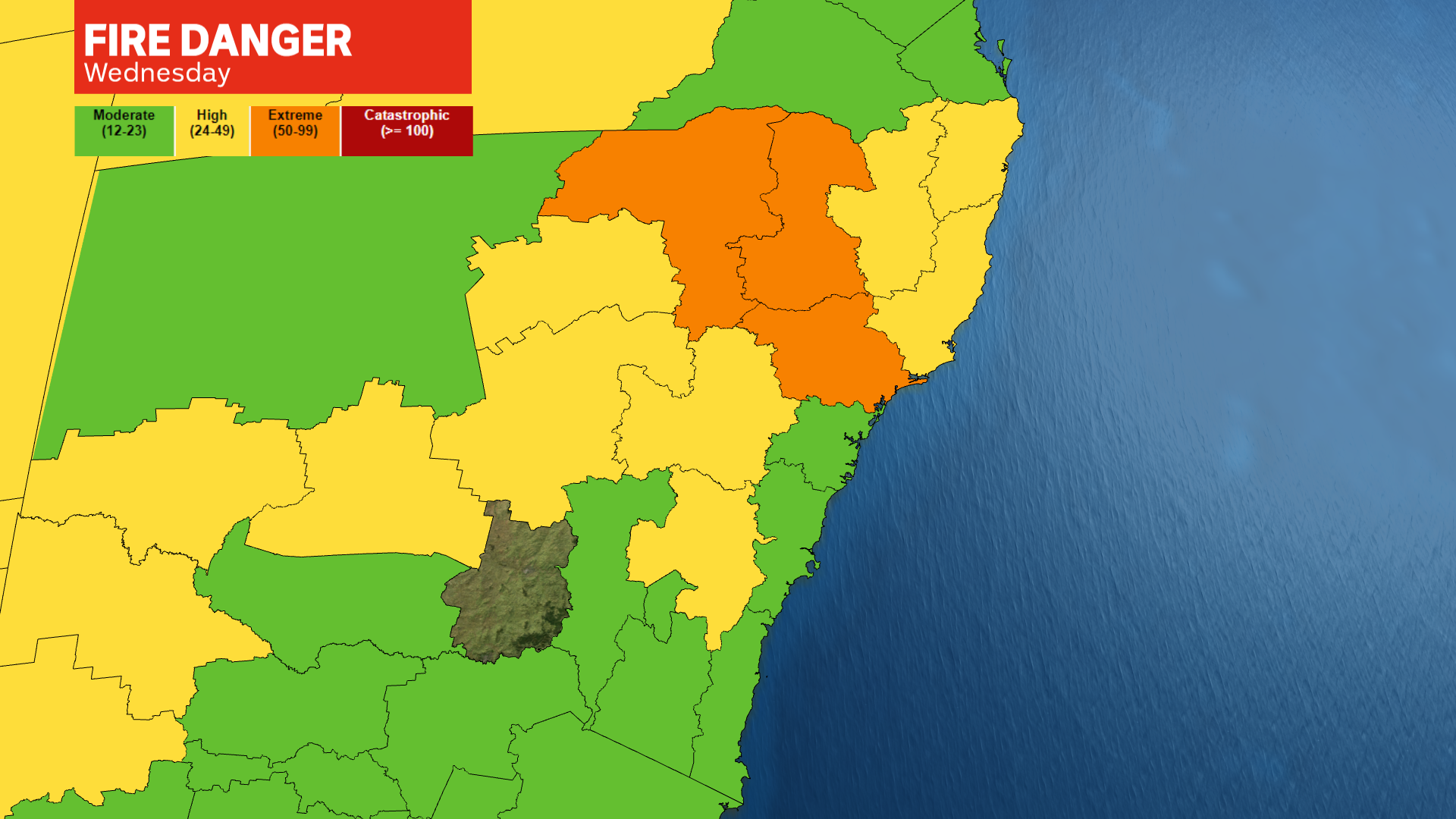 Map of NSW marked in green, yellow and orange by fire risk