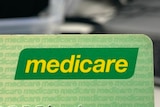 The corner of a green card with the Medicare logo 