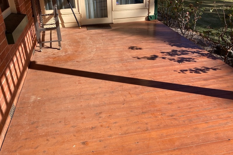 Tailings dust can be seen gathering on the verandah at a property in the mine's neighbourhood.