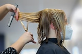 Woman getting her hair cut