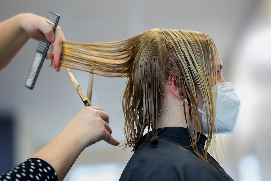 Woman getting her hair cut