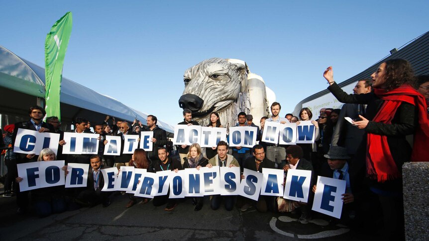 Greenpeace activists demonstrate in front of Greenpeace's giant polar bear, Aurora