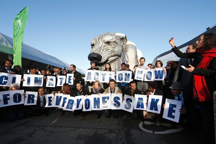 Greenpeace activists demonstrate in front of Greenpeace's giant polar bear, Aurora