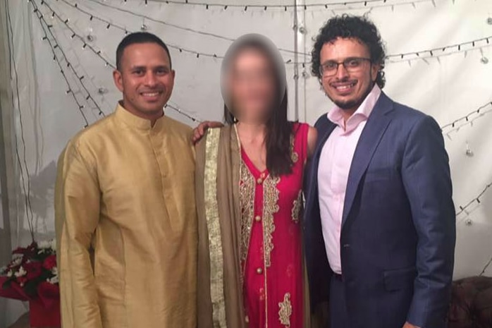 Cricketer Usman Khawaja stands next to two people including his brother Arsalan. The woman between them has her face blurred out