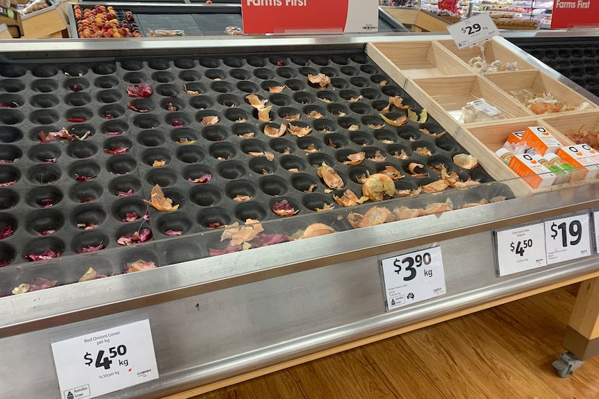Bare shelves in the fresh produce section at a Darwin supermarket.