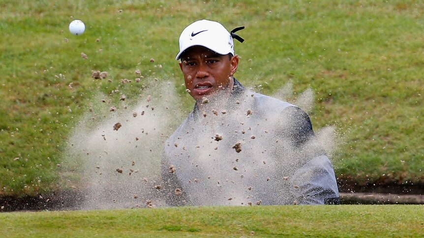 Tiger Woods hits out of the bunker during his third round at the British Open.