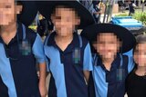 Four children with their faces pixelated.