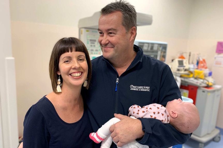 Katrina Kane and her partner Chris Shannon hold baby Bridie May Shannon.