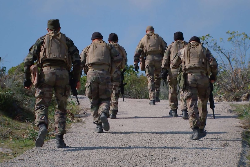 Legionnaires of the 2nd Foreign Parachute Regiment on the march.