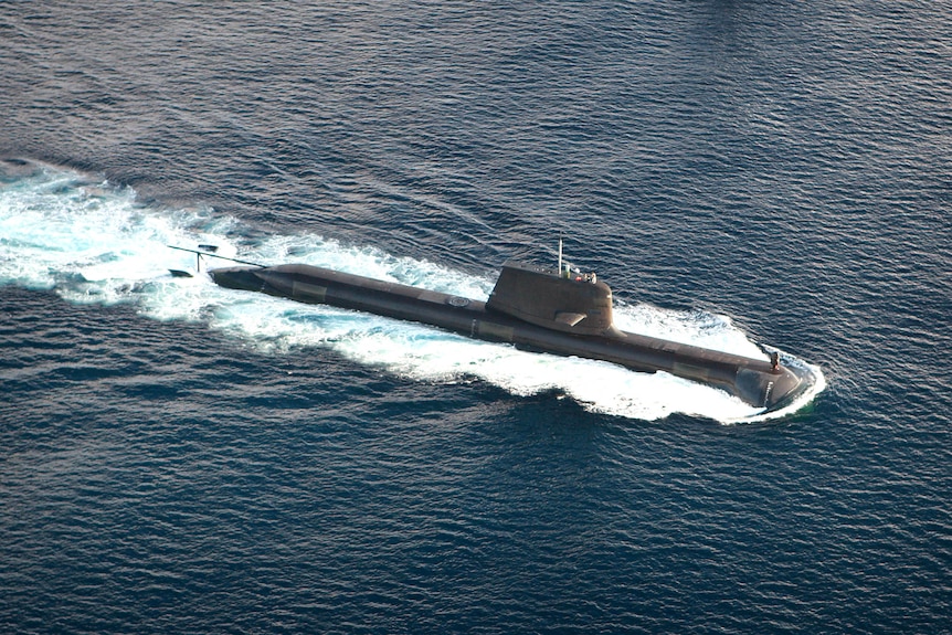 A submarine moves across the surface of the ocean.