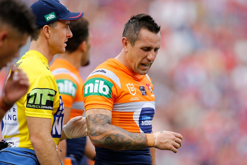 Newcastle's Mitchell Pearce leaves the field injured