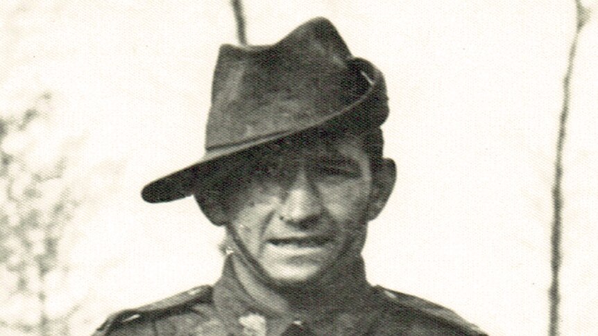 Portrait of an Australian soldier in his uniform wearing a slouch hat.