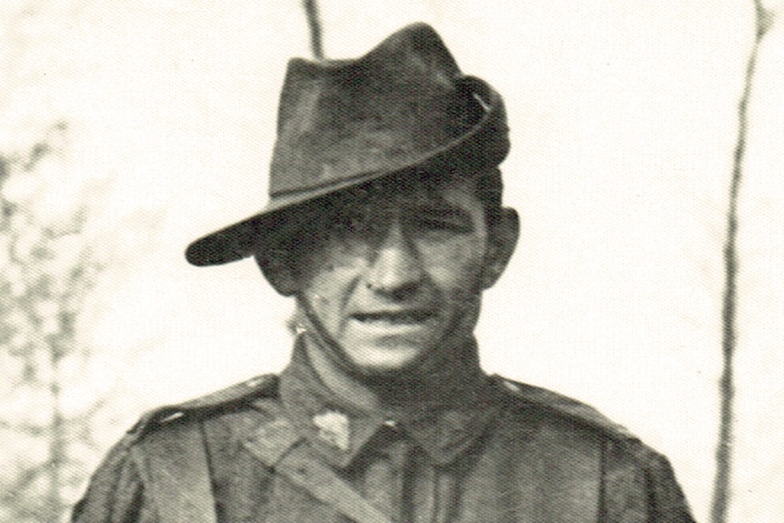 Portrait of an Australian soldier in his uniform wearing a slouch hat.
