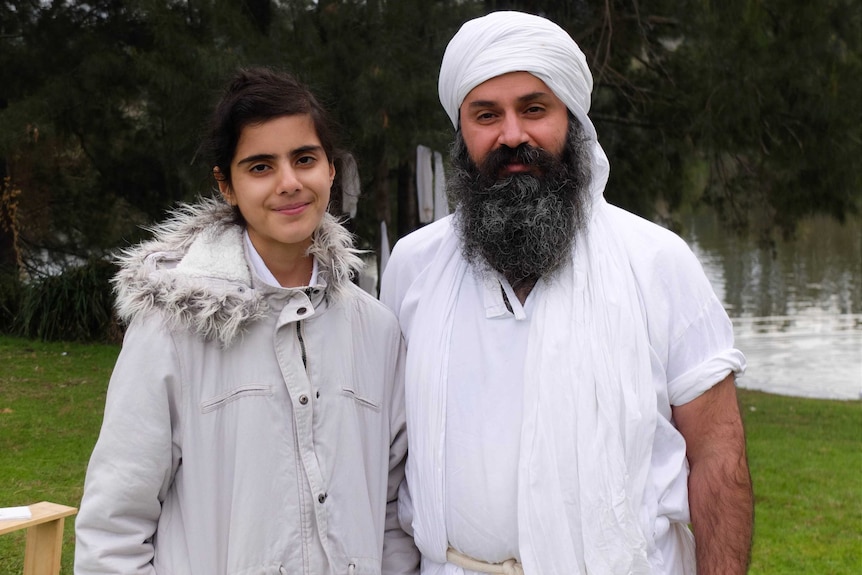 Anwar Hasan and her father, a Mandaean priest, beside the Nepean River.