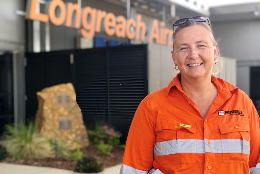 Jodie Harris smiles as she stands outside Longreach Airport.