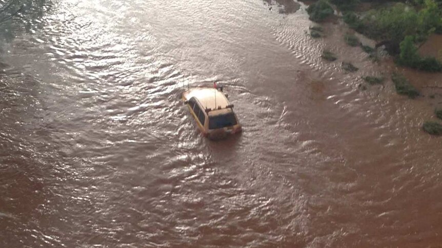 Vehicle stranded in flood waters