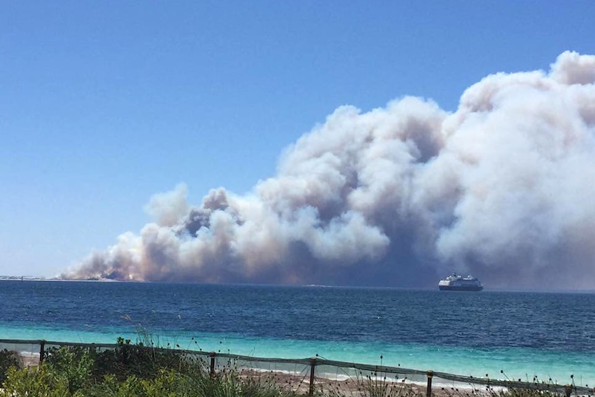 Huge plumes of smoke billow across the ocean near a cruise ship off the Esperance coast.